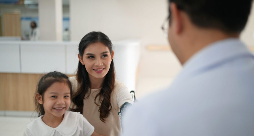 Child meeting a friendly dentist before first dental appointment.